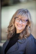 Emilie Adin in grey blazer