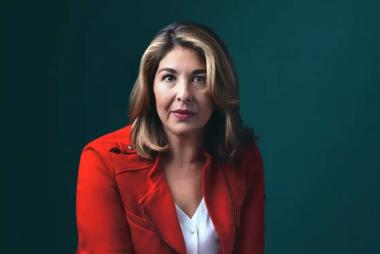 Naomi, in red blazer