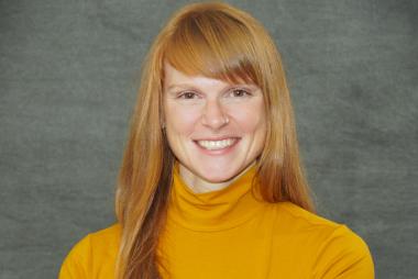 Woman in orange turtleneck