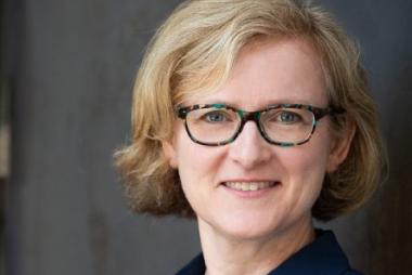 Dr. Barr, against stone wall