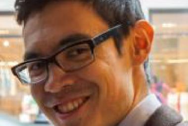 Dr. Machler, by window facing urban block