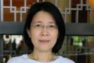 Dr. Wong, in front of ornate open wall fixture