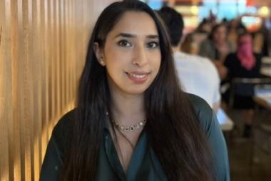 Woman near slated wood wall