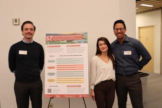 Stephen, Rudi, and Hussein pose next to their project
