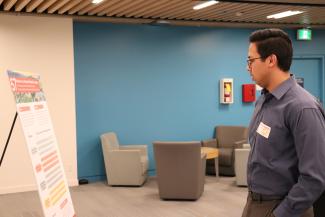 Hussein contemplating his presentation