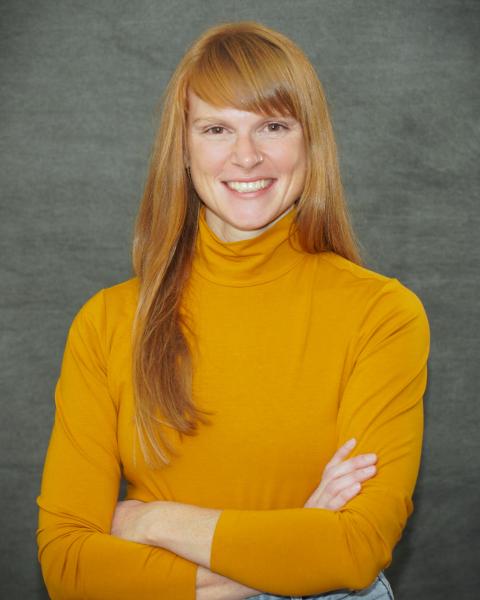Woman in orange turtleneck