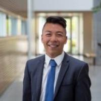 Kai&nbsp;Okazaki, smiling in office space