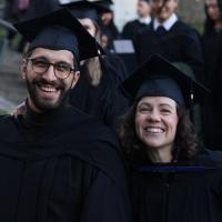 SCARP grads marching to their ceremony, arm in arm